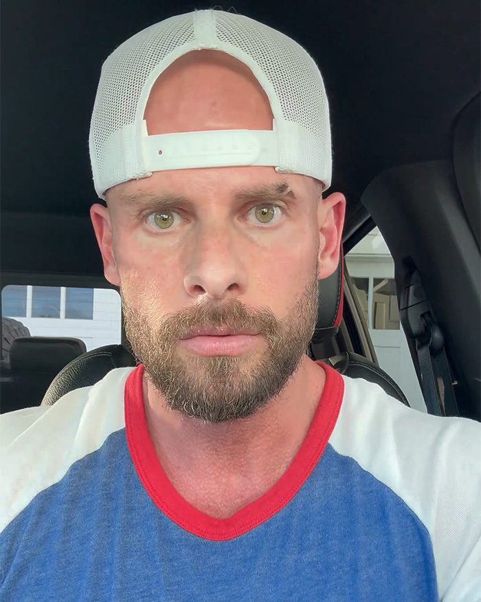 Close-up portrait of Joey Swoll wearing a white cap inside his car Close-up portrait of Joey Swoll wearing a white cap inside his car