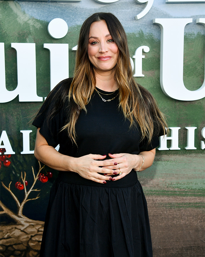 Kaley Cuoco smiling at event in black dress Kaley Cuoco smiling at event in black dress