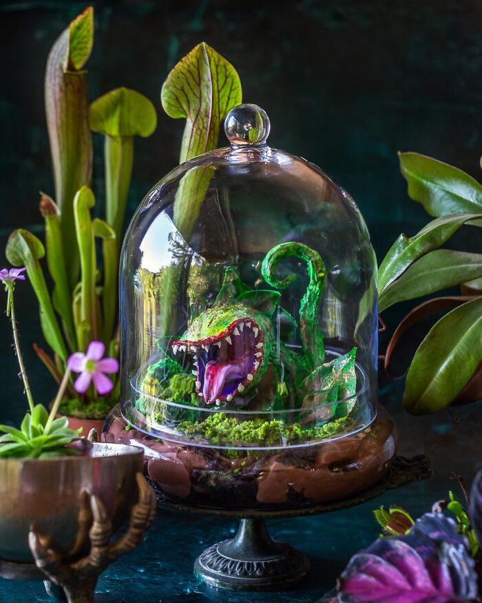 Venus flytrap monster cake display of Halloween foods.