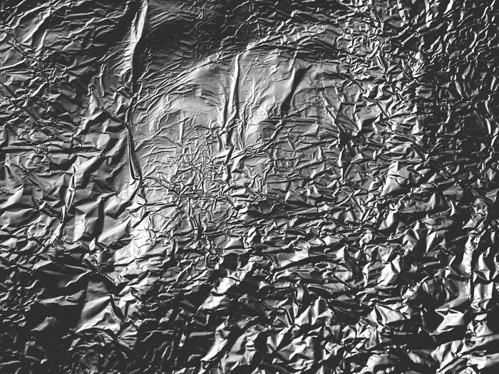 Wrinkled aluminum foil close up texture