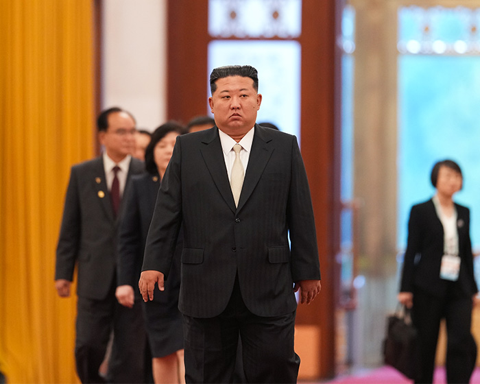 Kim Jong Un walking in a suit amid rumors from North Korea and China. Kim Jong Un walking in a suit amid rumors from North Korea and China.