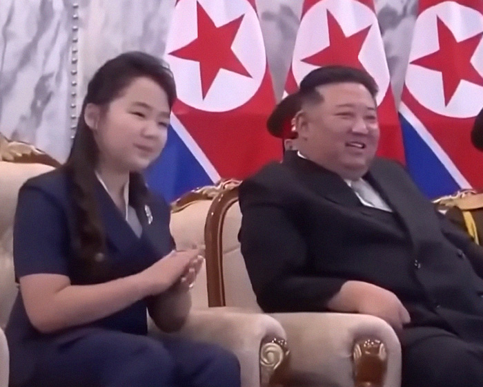 Kim Jong Un seated with a young girl amid North Korea rumors. Kim Jong Un seated with a young girl amid North Korea rumors.