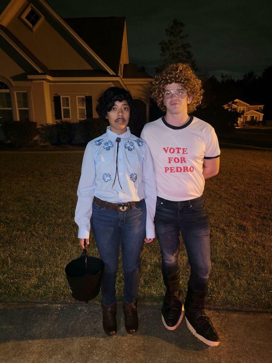 A couple dressed as Napoleon Dynamite and Pedro, a nostalgic Halloween costume idea.