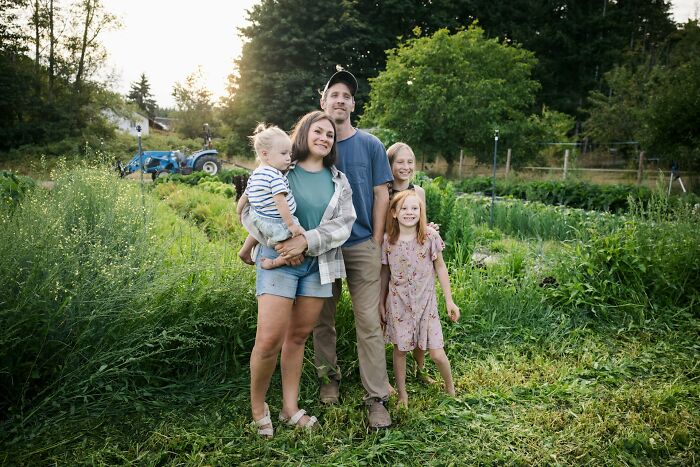 A family standing together outdoors near a garden, reflecting on complex infidelity stories and personal relationships.
