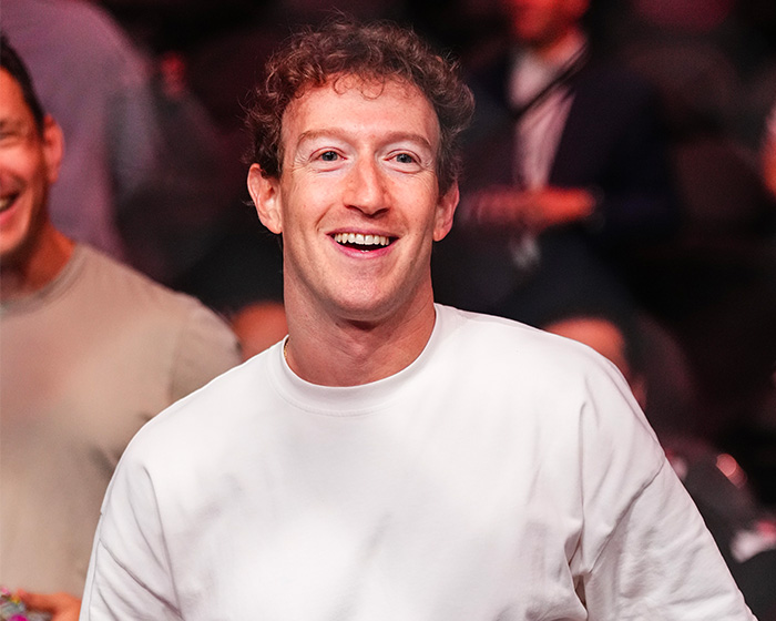 Mark Zuckerberg smiling in a white shirt amidst bizarre behavior online reactions. Mark Zuckerberg smiling in a white shirt amidst bizarre behavior online reactions.