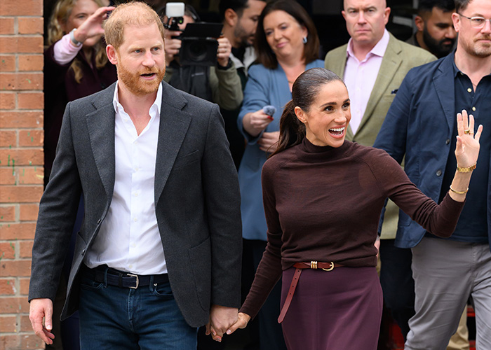 Meghan and Harry smiling and holding hands during Nottingham outing Meghan and Harry smiling and holding hands during Nottingham outing