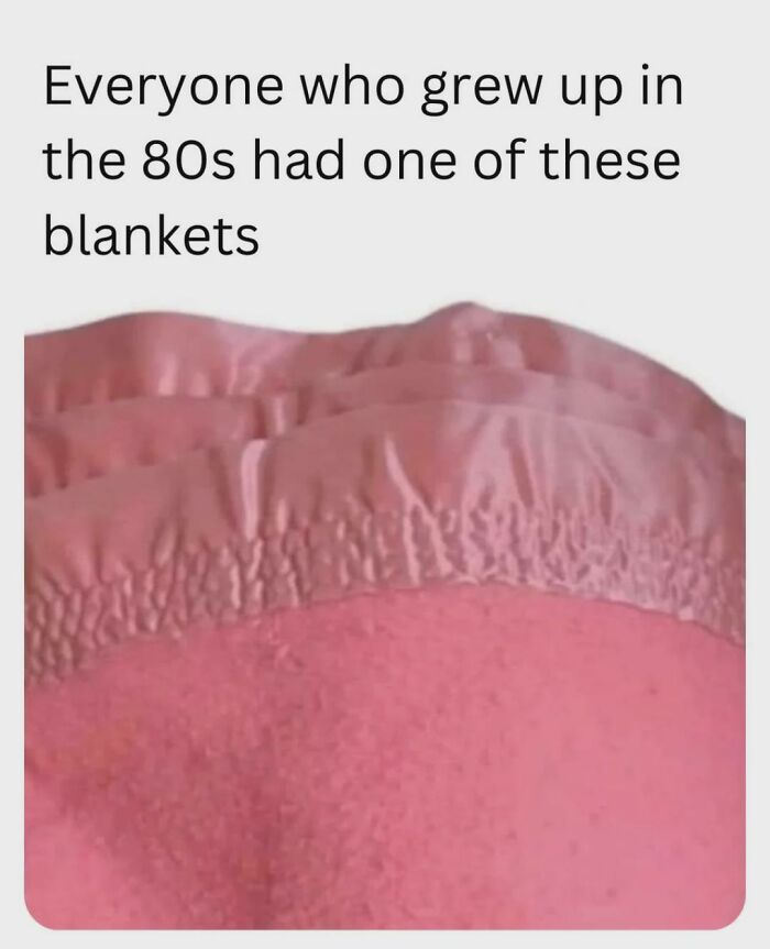 Close-up of a pink blanket with a satin trim, featured in nostalgic photos for 80s kids.