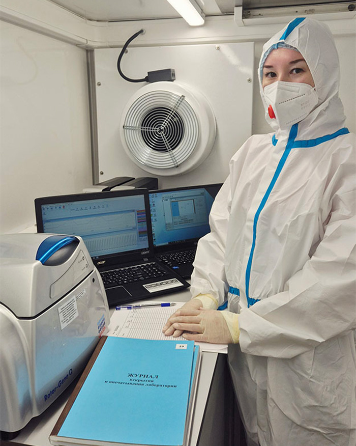 Researcher in a protective hazmat suit working inside a suspected plague lab leak facility. Researcher in a protective hazmat suit working inside a suspected plague lab leak facility.