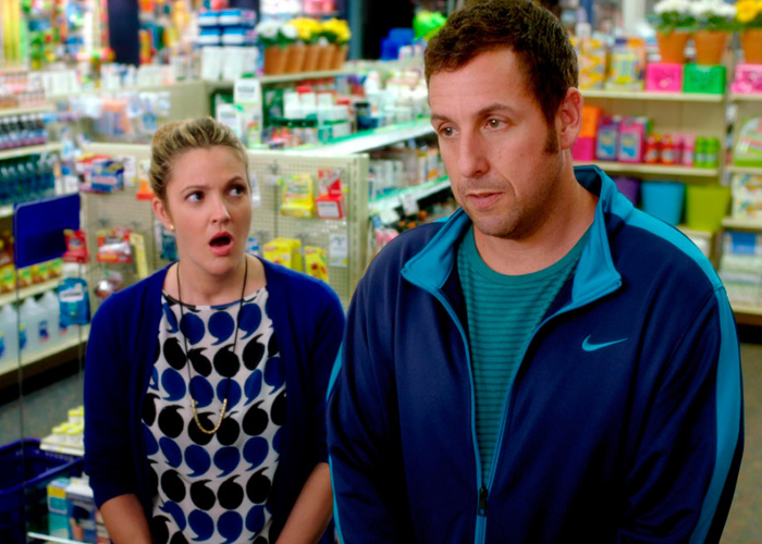Adam Sandler looking surprised alongside Drew Barrymore in a movie scene