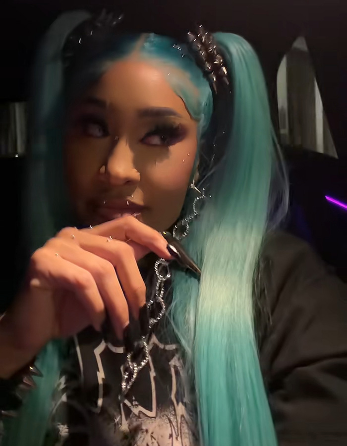 Natalie Nunn showing detailed makeup and long blue pigtails in a Halloween transformation selfie