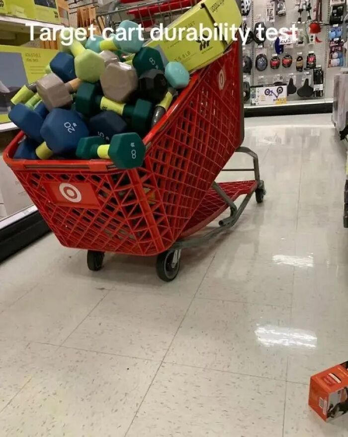 Target shopping cart overloaded with heavy dumbbells testing cart durability