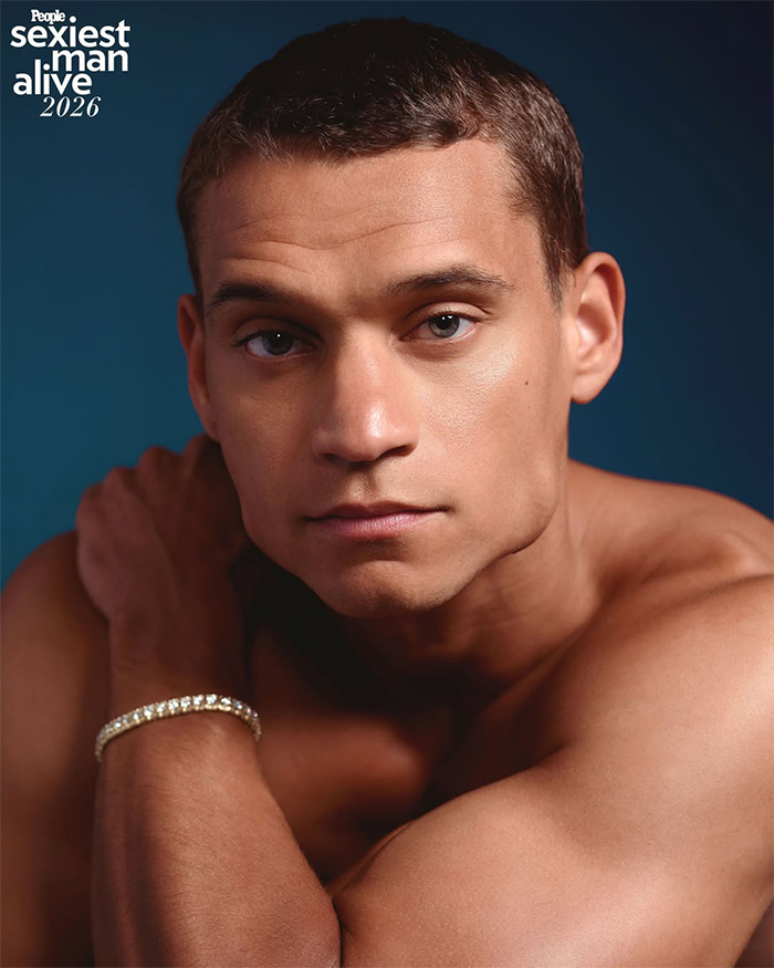 Close-up portrait of a man posing shirtless for a Sexiest Man Alive photoshoot.