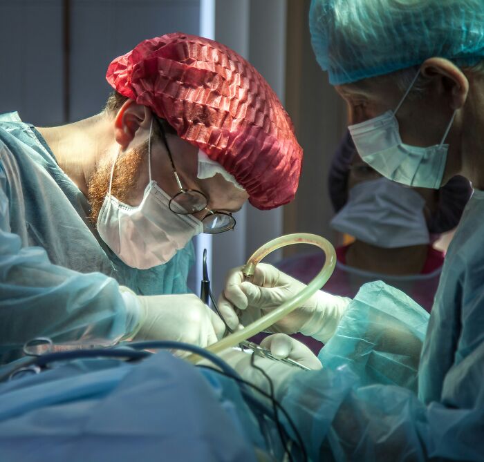 Medical professionals performing a surgery, depicting a scenario where clients lose trust instantly.
