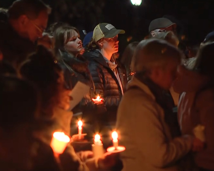 People holding candles in a nighttime vigil for Oregon elementary school tragedy victims People holding candles in a nighttime vigil for Oregon elementary school tragedy victims