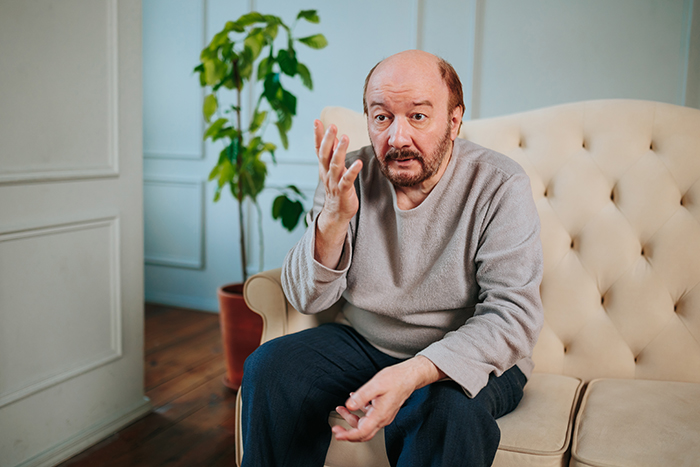 An older man looking stressed and gesturing, symbolizing a dad reacting to a clear boundary. An older man looking stressed and gesturing, symbolizing a dad reacting to a clear boundary.