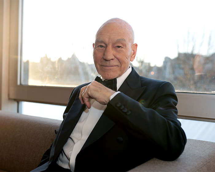 Actor Patrick Stewart dressed in a formal tuxedo, showcasing his lasting legacy and relationship with his kids.