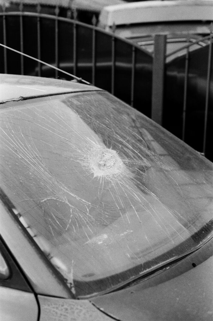 Cracked car windshield symbolizing damage from Karen incidents