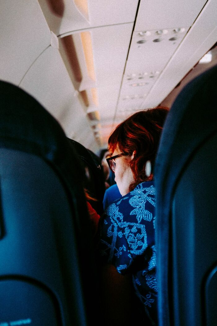 Passengers sitting in airplane seats looking for comfortable flights