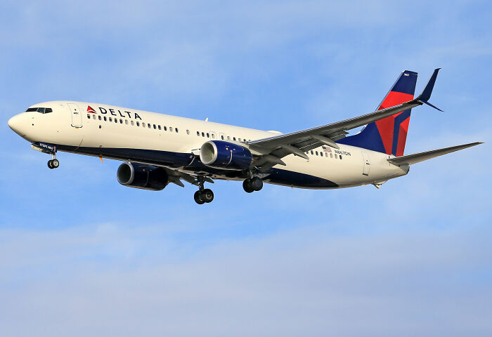 A Delta passenger airplane flying in the sky following Selma Blair mid-flight incident. A Delta passenger airplane flying in the sky following Selma Blair mid-flight incident.