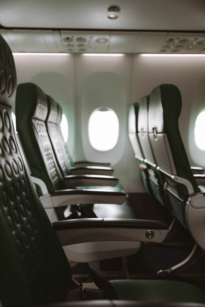Empty seats in an airplane cabin representing clever life tricks for comfortable travel