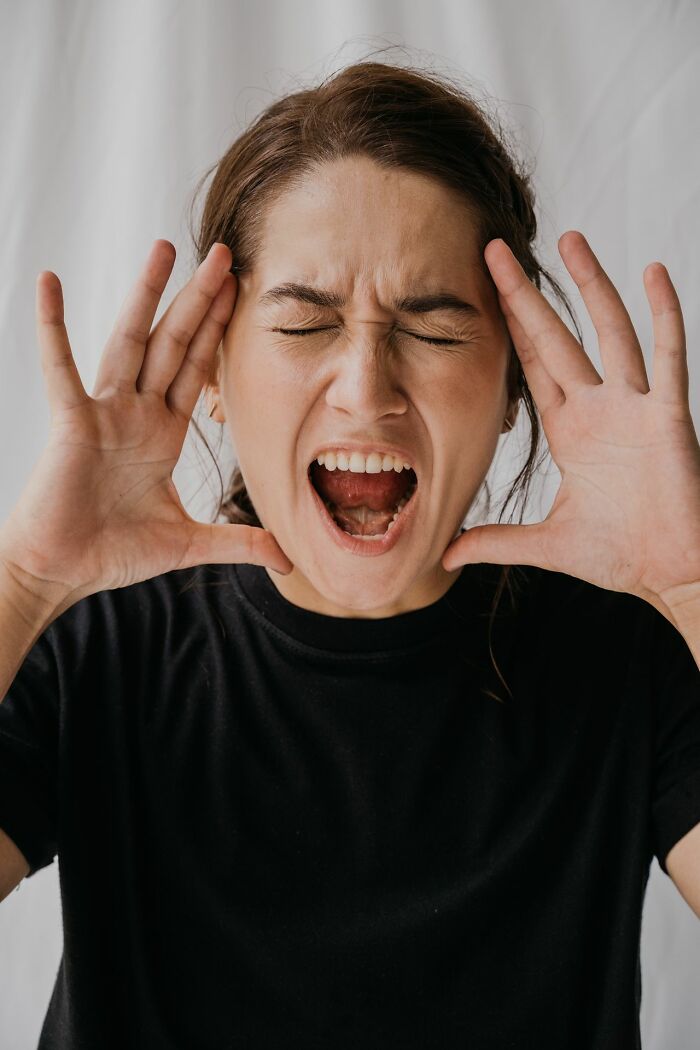 Stressed woman shouting showing emotions linked to kids' embarrassing Karen stories