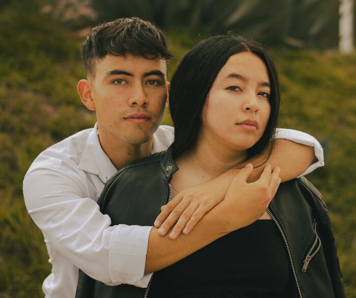 Young couple outdoors showing support amid microaggressions discussion