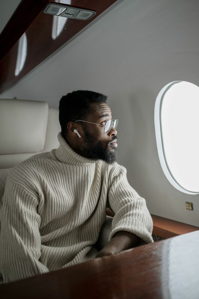 A man looks out of the window from his comfortable seats during a trip