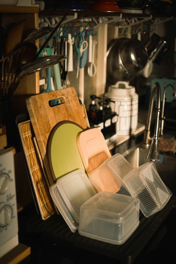 Organized kitchen tools and containers drying highlighting life hacks