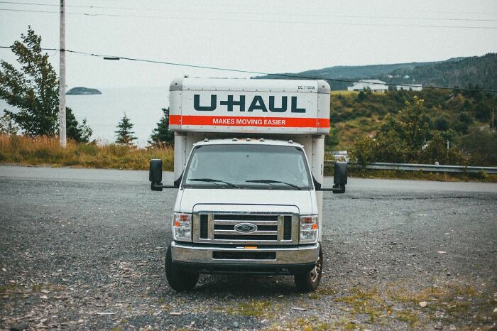 A white U-Haul moving truck parked outdoors illustrating clever life tricks for moving