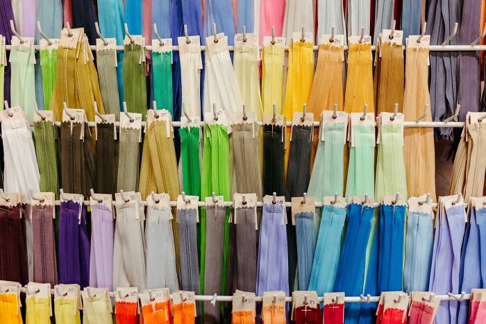 Colorful fabric ribbons hanging on display racks