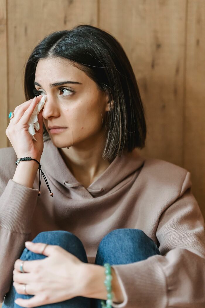 Woman wiping tears feeling embarrassed from Karen stories