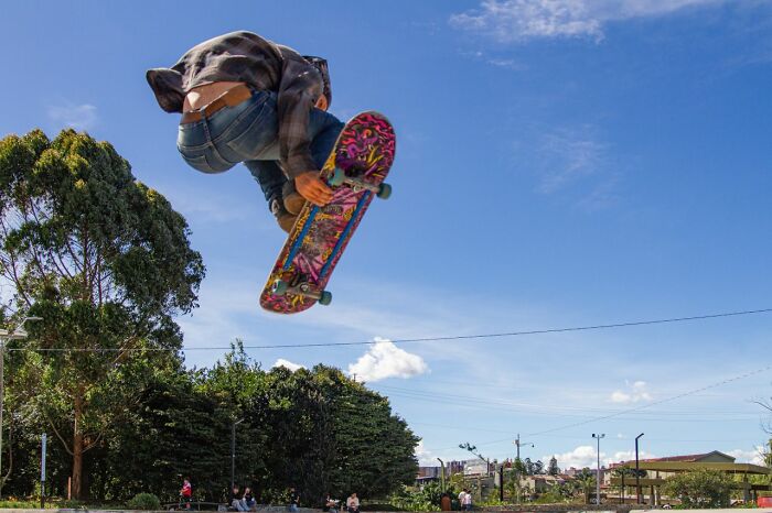 A skateboarder mid-air capturing funny instances before embarrassing fails happen