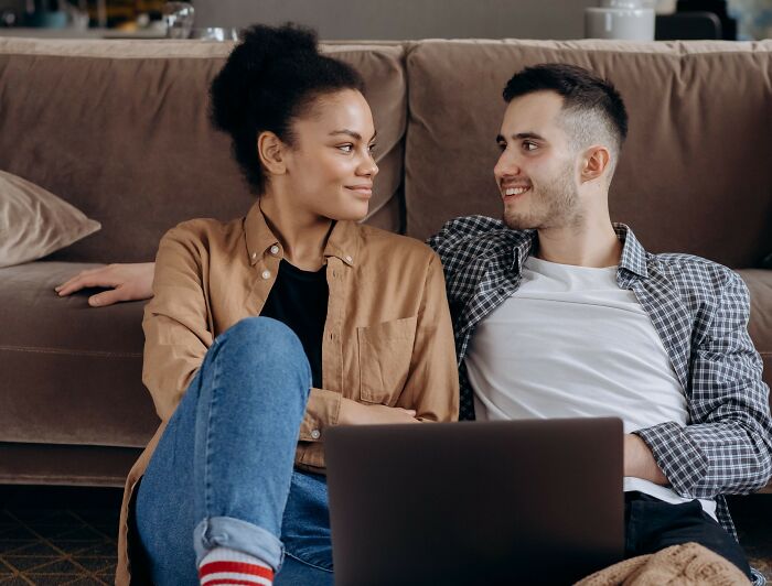 Couple smiling and interacting while discussing microaggressions women experience