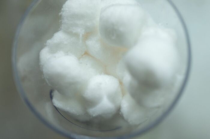 Cotton balls in transparent container for practical life hacks