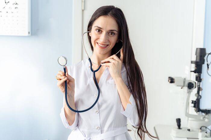 A female doctor holding a stethoscope, related to dumb things professionals said in healthcare settings