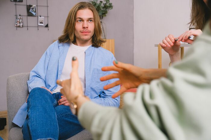 Man attentively listening during a conversation about microaggressions women hear