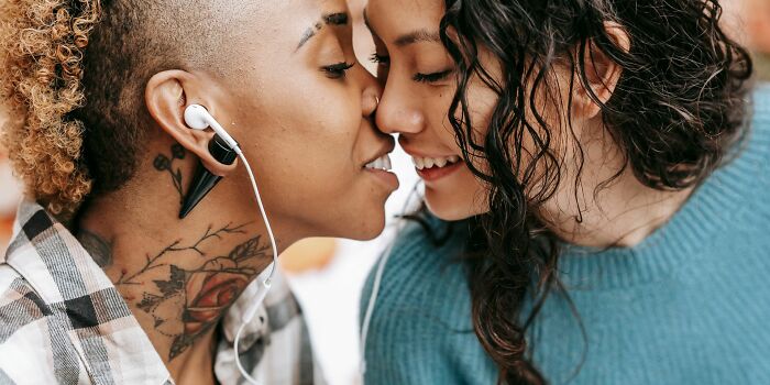 An affectionate, smiling couple closely embracing, representing the bonds of a healthy marriage.