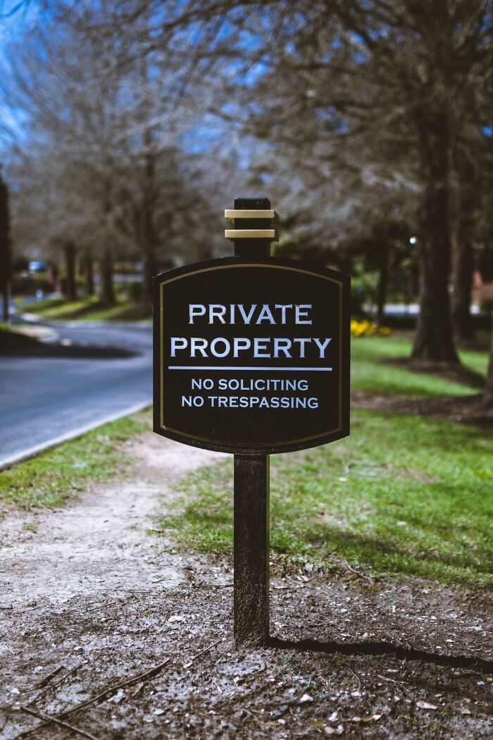 A private property no trespassing sign, illustrating a scene from satisfying revenge stories.