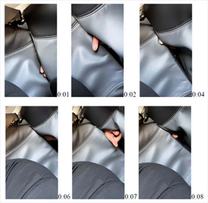 Footage frames showing a hand reaching through airplane seats during a crime mid-flight