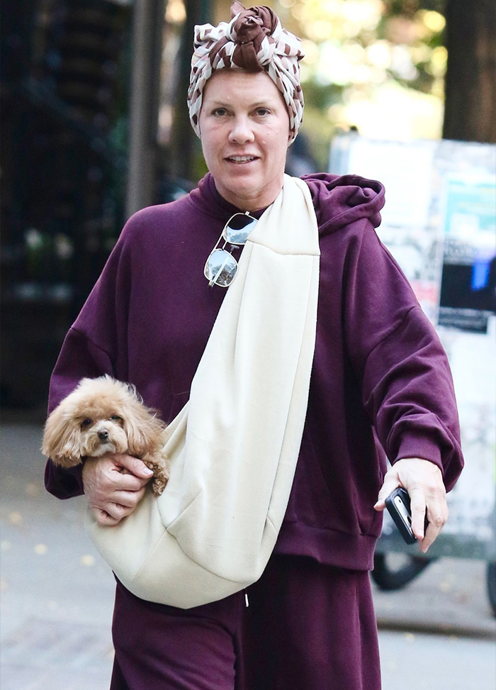 Singer Pink wearing a headscarf and casual hoodie in a makeup-free photo