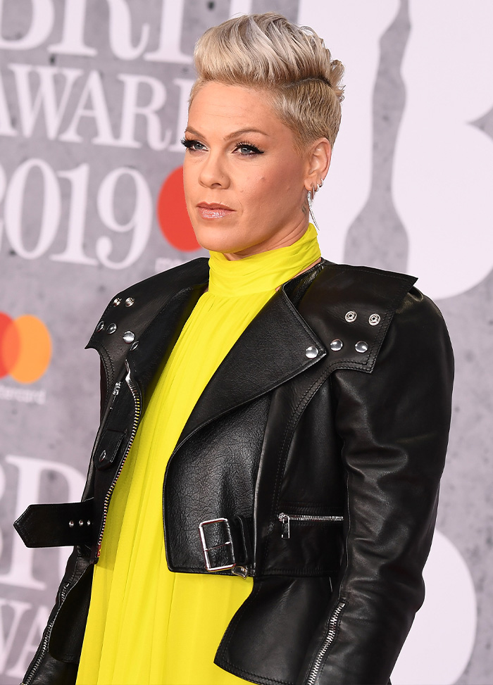 Singer Pink looking stylish in a black leather jacket on the red carpet
