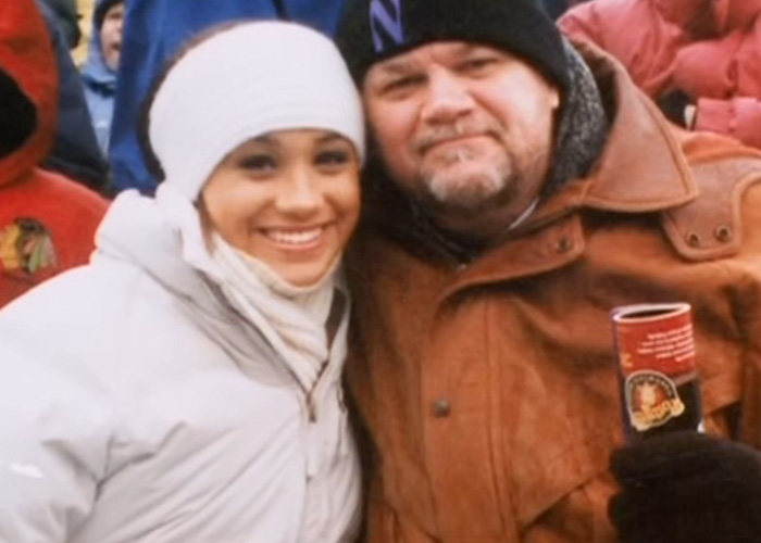 Young Meghan Markle smiling next to her dad Thomas Markle in winter clothes. Young Meghan Markle smiling next to her dad Thomas Markle in winter clothes.