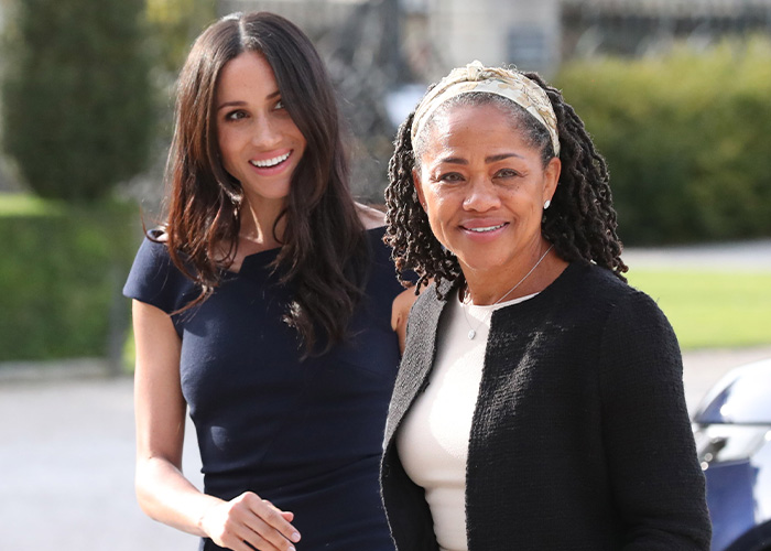 Meghan Markle smiling alongside her mother Doria Ragland during a public outdoor appearance. Meghan Markle smiling alongside her mother Doria Ragland during a public outdoor appearance.