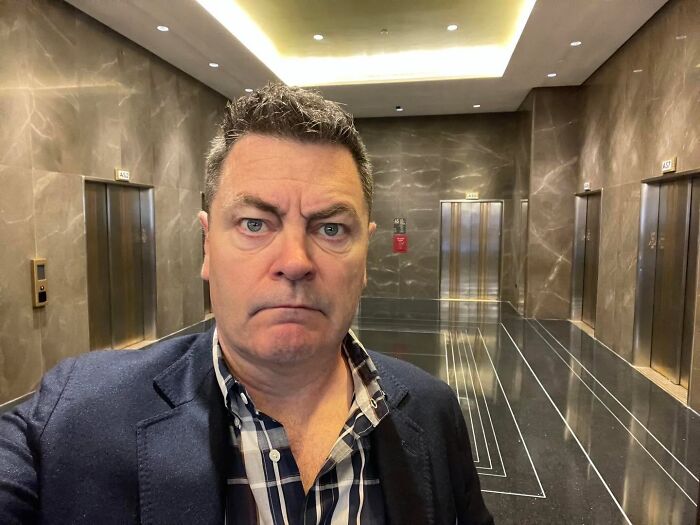 Actor Nick Offerman taking a selfie, showcasing authentic positive masculinity.