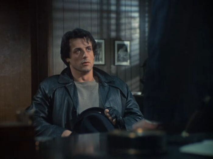 Sylvester Stallone as Rocky Balboa, portraying positive masculinity and emotional strength
