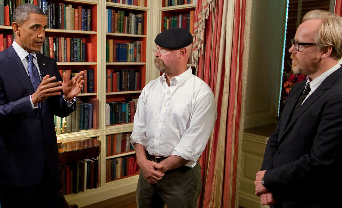Barack Obama engaged in a respectful conversation, displaying positive masculinity in leadership.