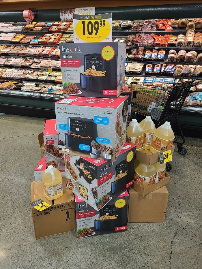 A display of air fryers next to cooking oil highlighting advertising fails