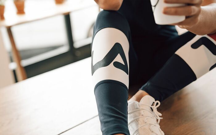 Person sitting in athletic wear representing someone who got fired before their first week ended