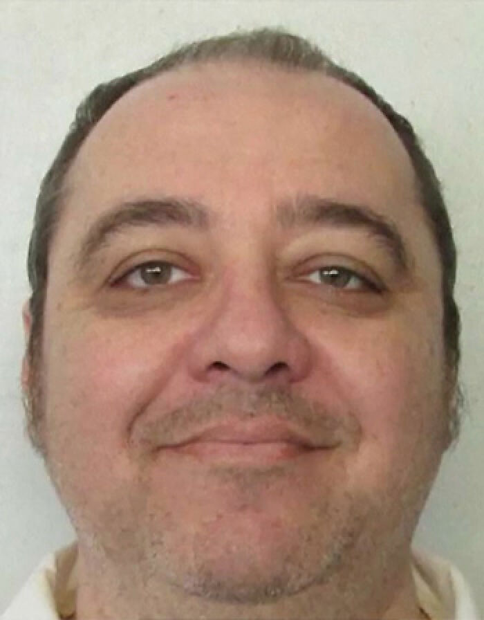 Mugshot of Richard Glossip, a d***h row inmate facing lethal injection.