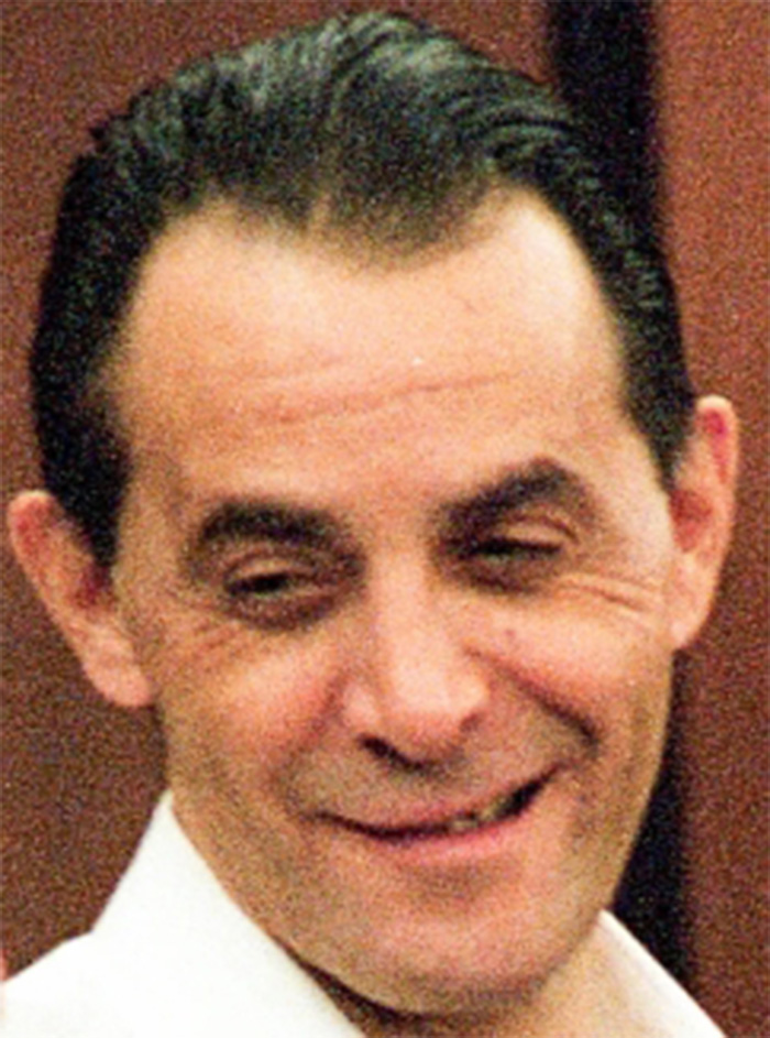 A smiling man looking sideways, one of the individuals who survived lethal injection.